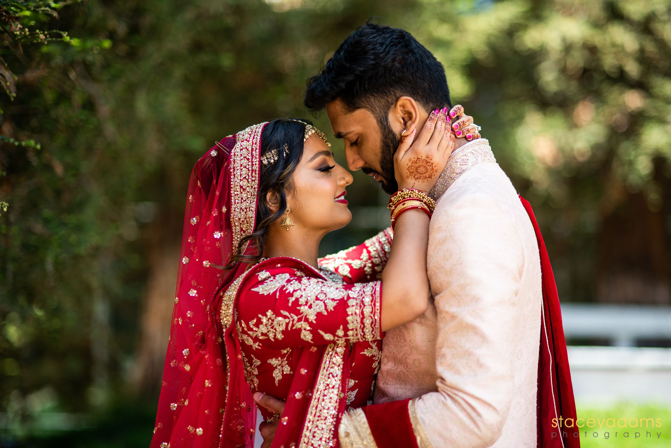 Indian Wedding Couple embracing by Stacey Adams